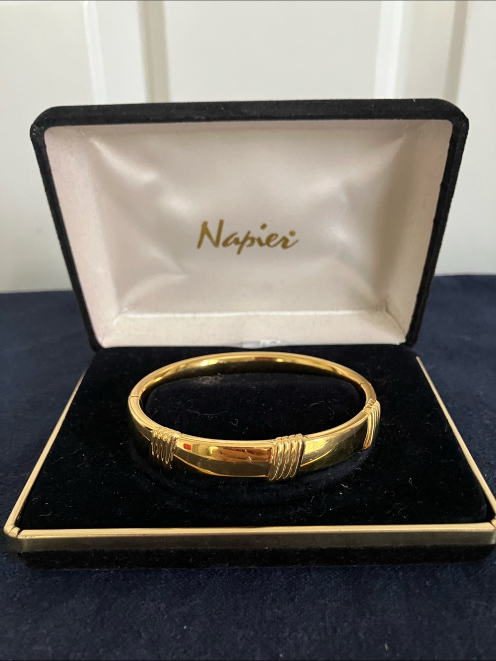 Napier Gold Tone Ribbed Accent Hinged Bangle Bracelet